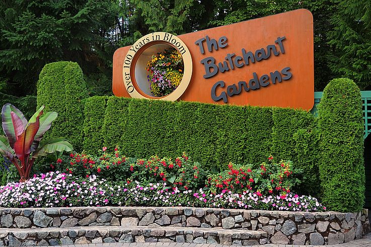 Entrance sign and flower beds at Butchart Gardens.