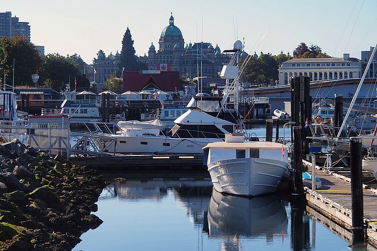 Boats moored in the Inner Harbour facing the British Columbia Parliament Building in Victoria.
