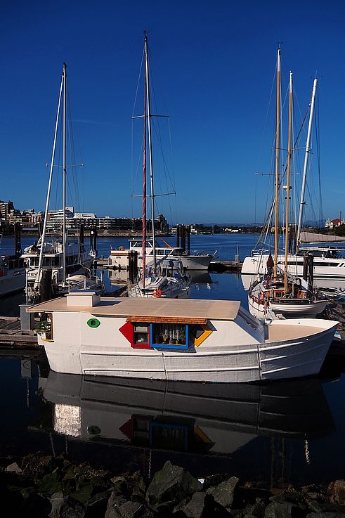 Colorful houseboat in Victoria's Inner Harbour.
