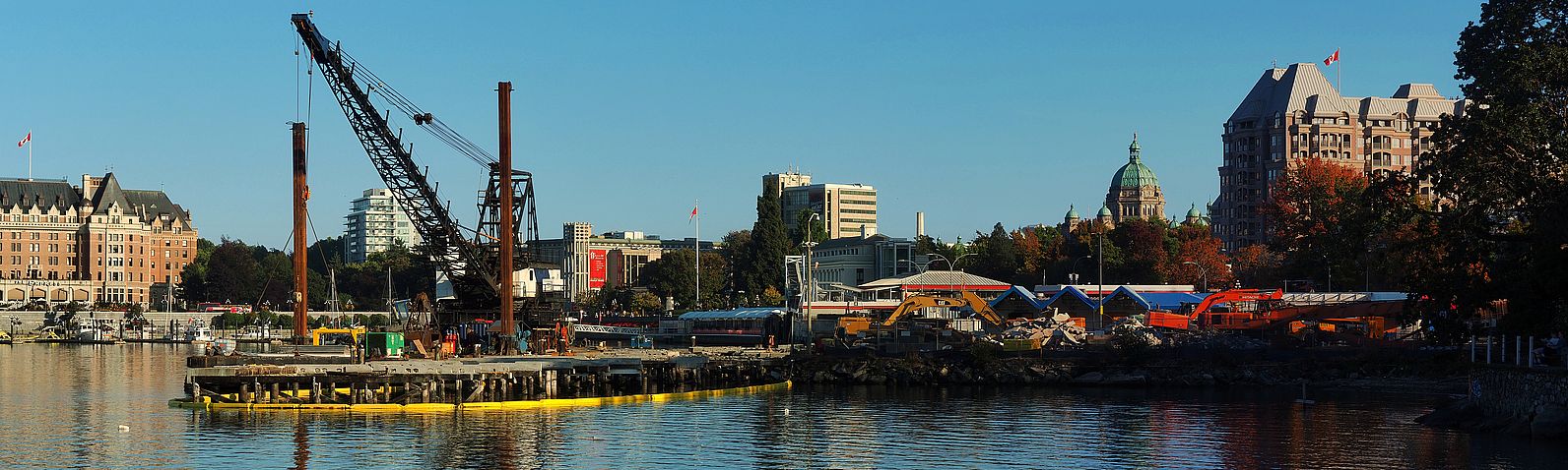 Construction site in Victoria's Inner Harbour, with the Fairmont Empress Hotel and the British Columbia Parliament Buildings in the background.