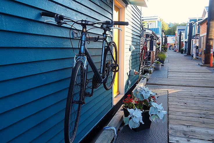 Bicycle hanging on a floating home on the Fisherman's Wharf dock in Victoria.