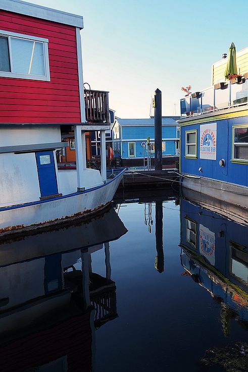 Colorful floating houses at Fisherman's Wharf in Victoria.