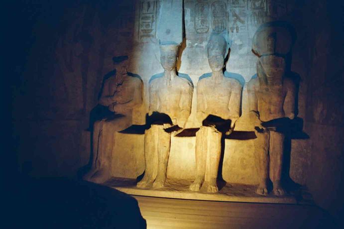 The four illuminated statues in the naos of Abu Simbel.