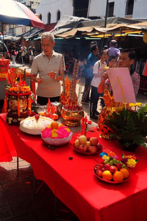 Table of ritual offerings in Chinatown, Kuala Lumpur.