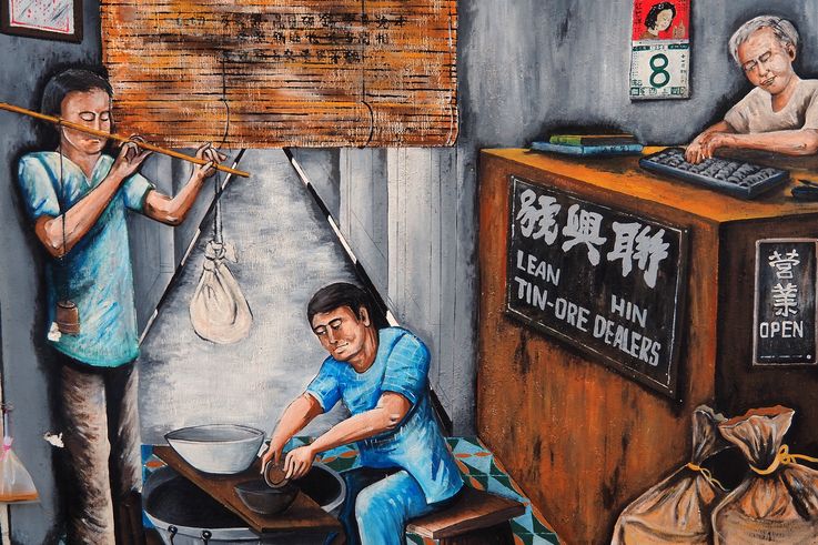Ipoh mural, historic tin trade scene with scales and abacus.