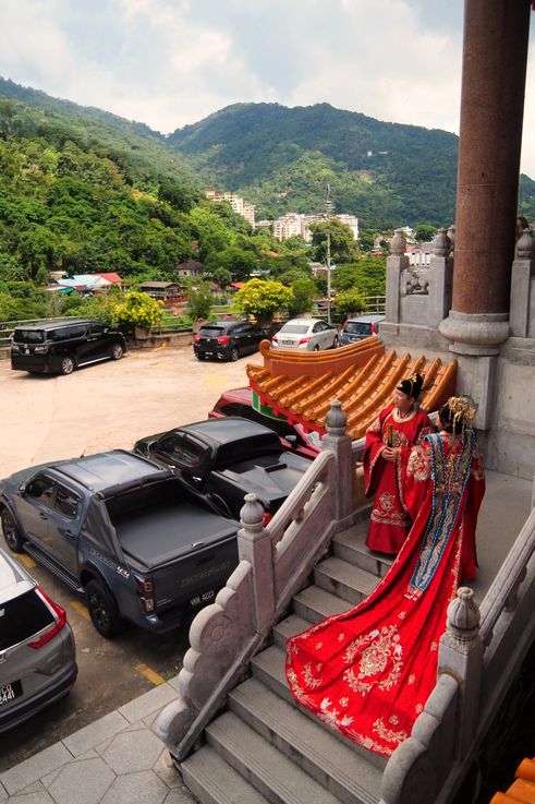 People in traditional Chinese attire at Kek Lok Si Temple, George Town.
