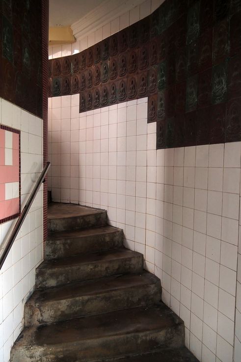 Interior staircase of the Pagoda of Ten Thousand Buddhas, George Town, with Buddha figures.