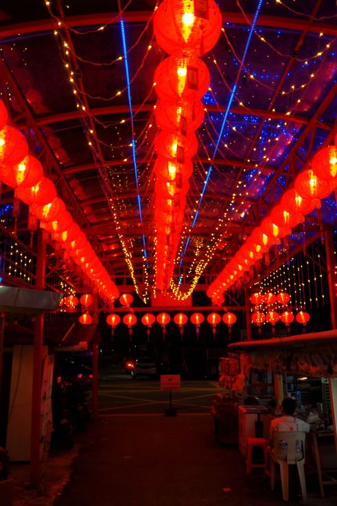 Covered alley illuminated with red lanterns in Georgetown.