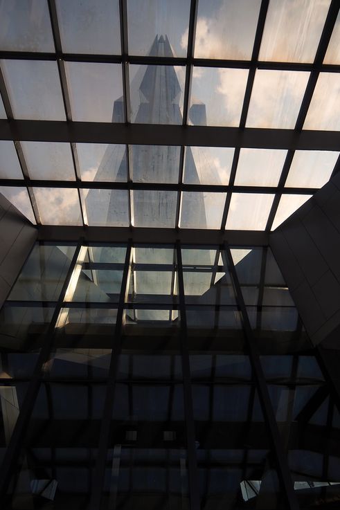 Merdeka 118 through a geometric glass ceiling, Kuala Lumpur.