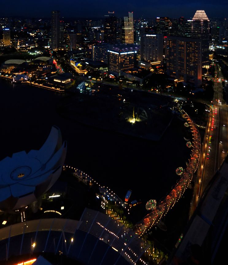 Marina Bay at night, with Marina Bay Sands, ArtScience Museum, and Helix Bridge.