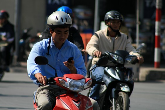 Mobile by scooter in Hanoi